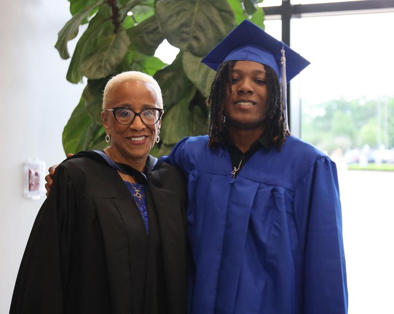 Holloway High School Principal Sumatra Drayton and student at 2025 graduation ceremony.