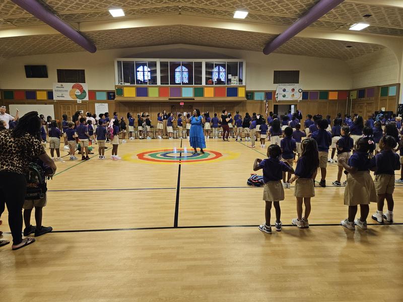 Scholars gather in the gym for morning assembly.