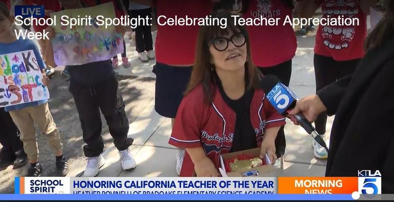 Teacher interviewed by a reporter on TV News.