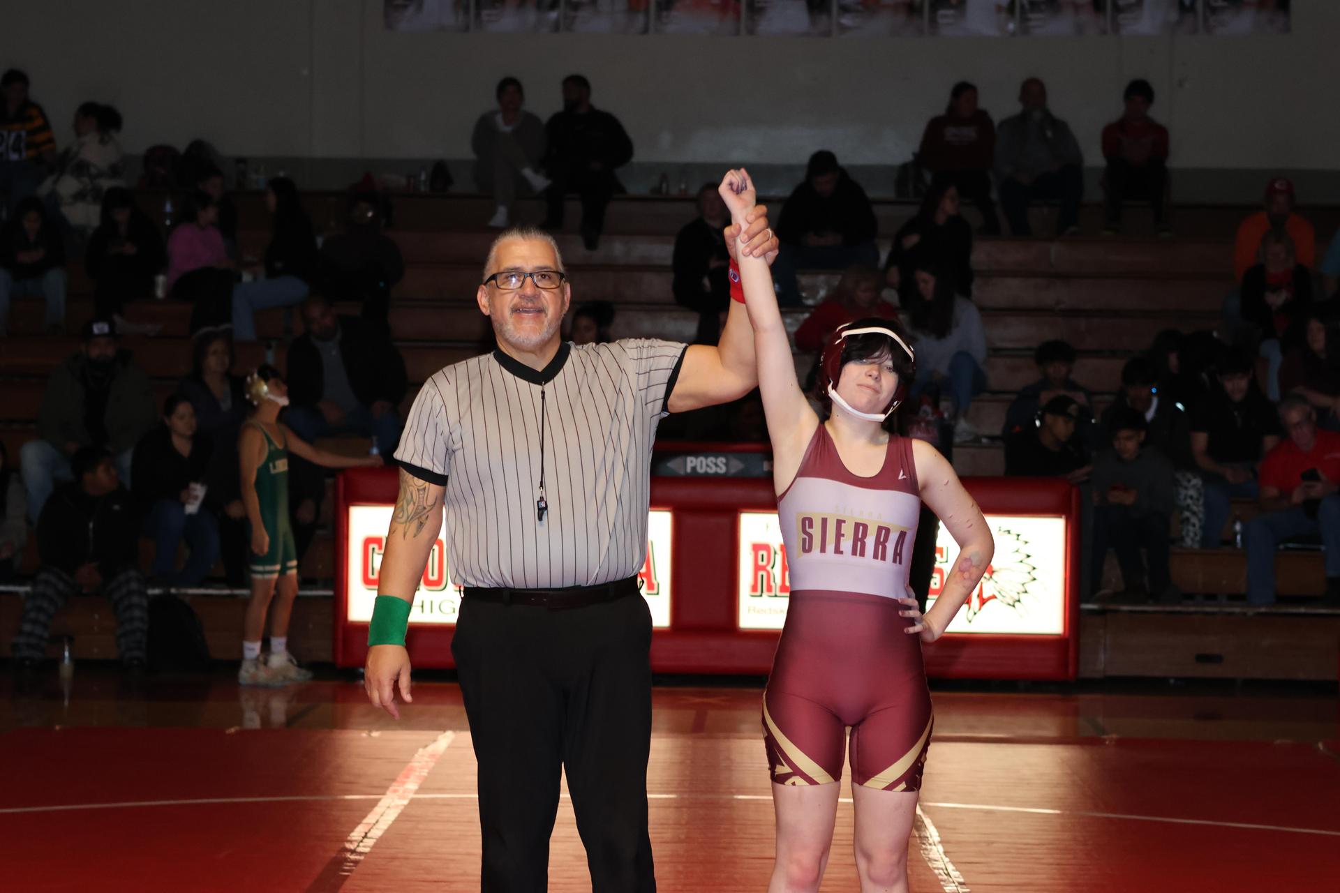 Wrestling winners with hands up 54