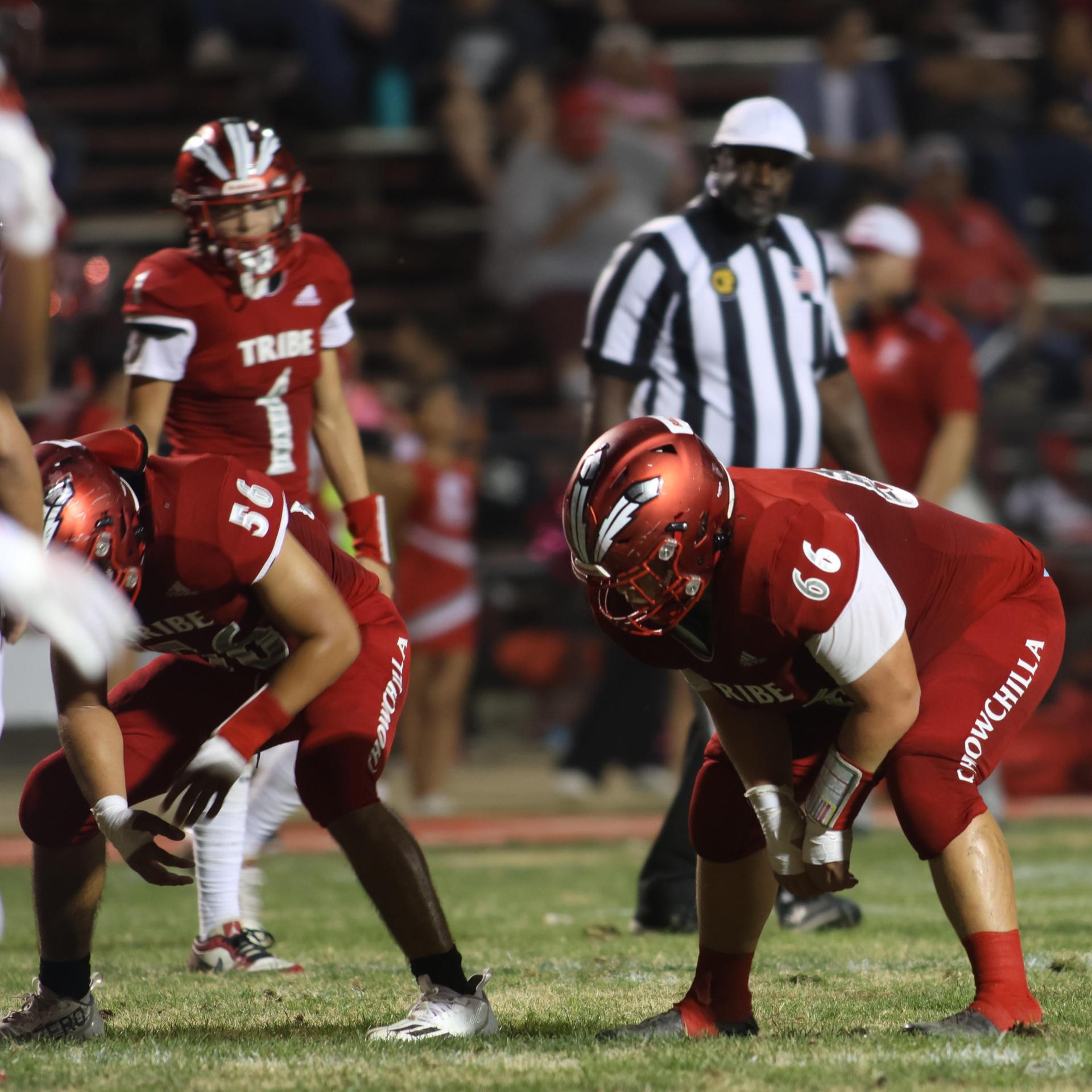 varsity boys playing football against Fowler