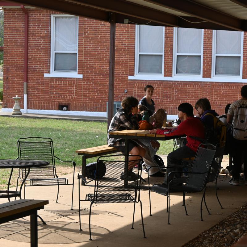 High School outside eating lunch.