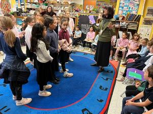 The third grade girls daven with the kindergarten