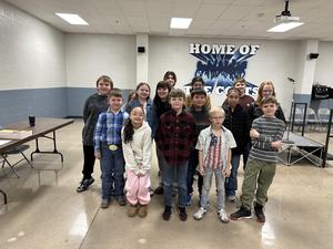 Students competing at spelling bee