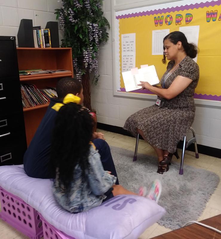 Ms. Steward reads to the MBC class.
