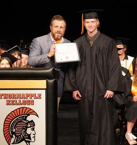 Nick Wake presents a scholarship to Benjamin Bowman.