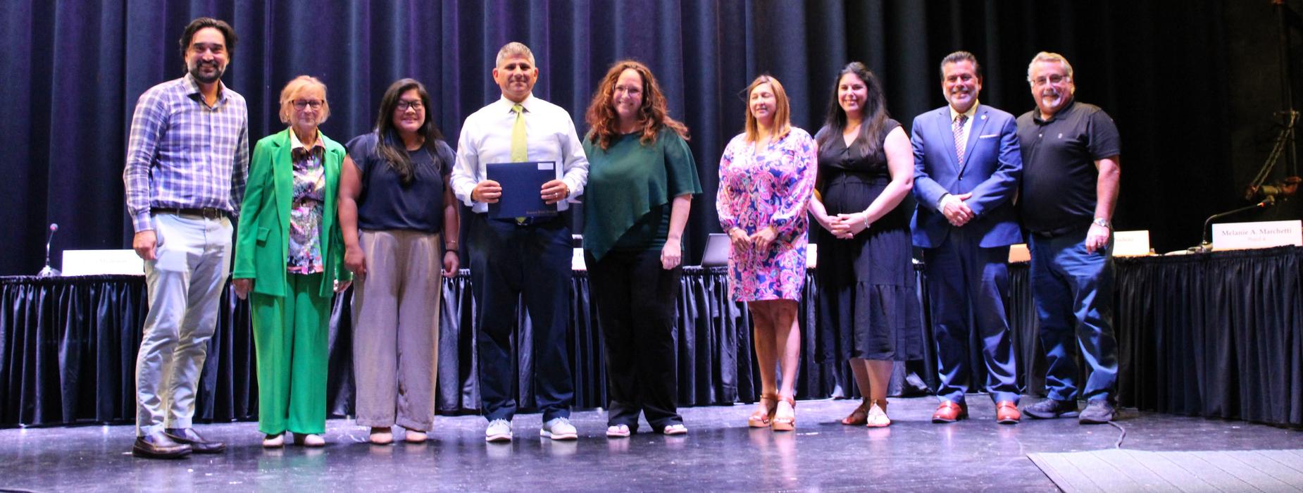 RIMEA Administrator of the Year Tom Barbieri poses with the school committee.