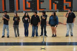 Puente seniors standing in middle of gymnasium