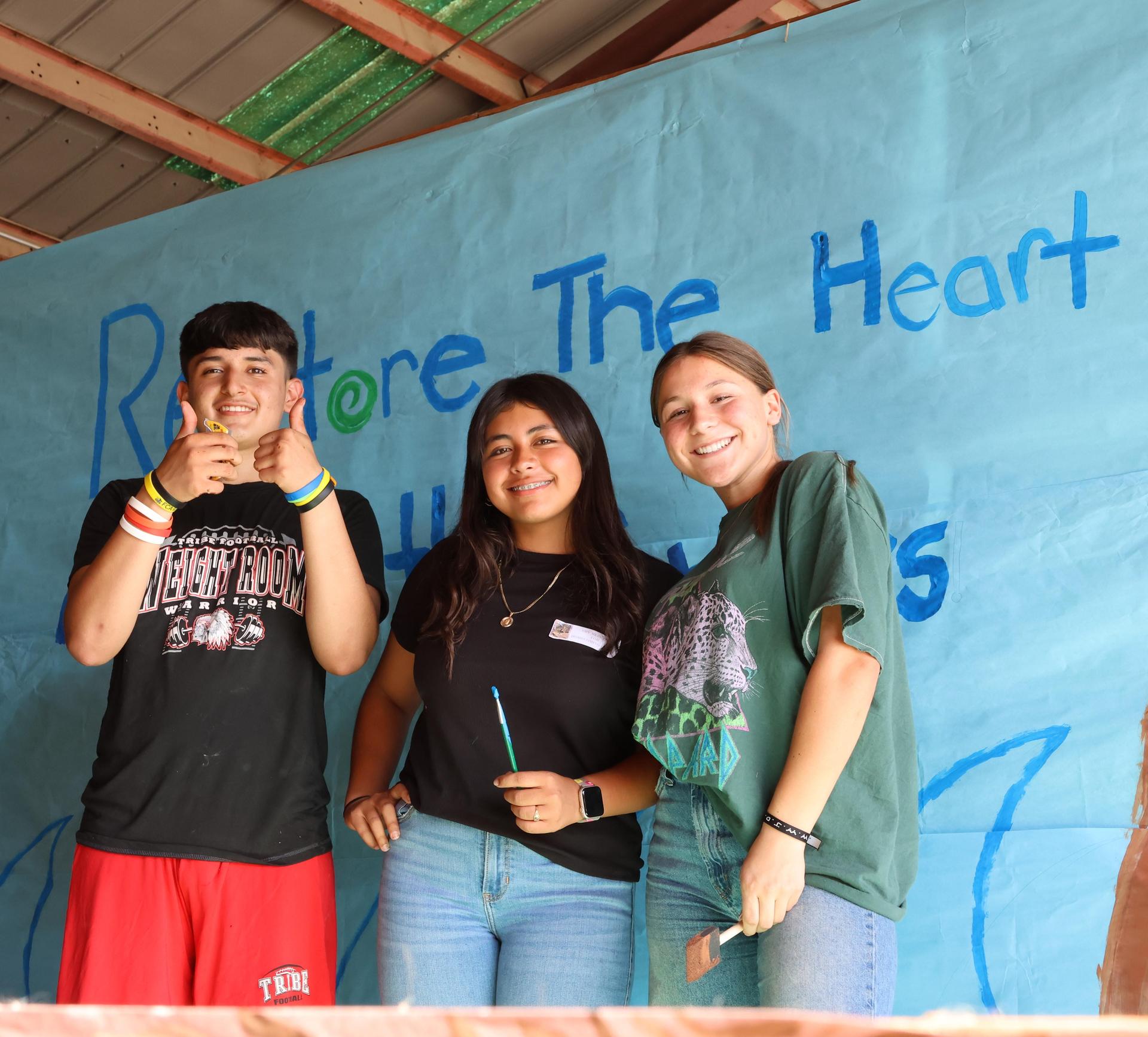 students, parents, and staff building floats for homecoming