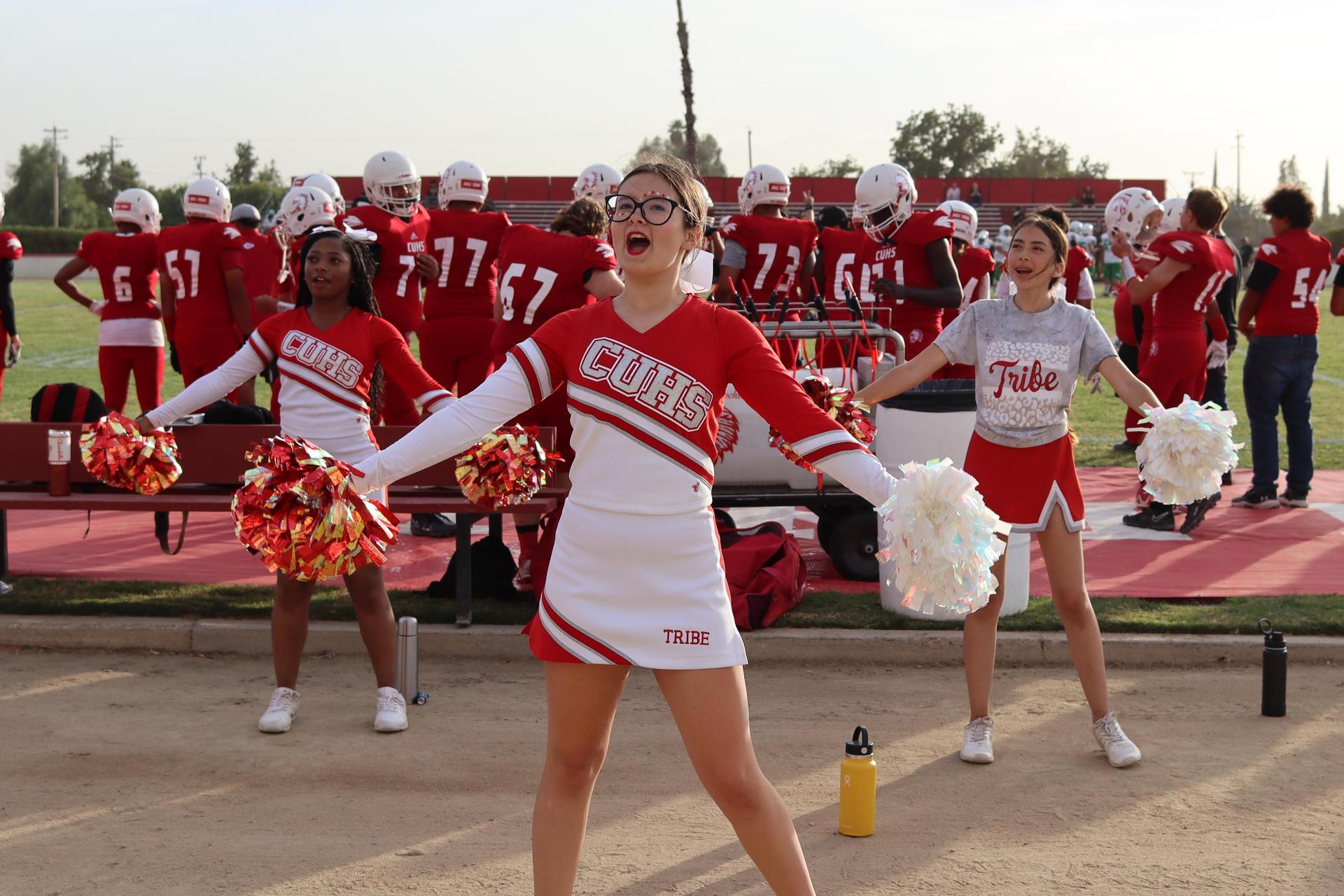 junior varsity cheerleaders in action at the Riverdale game