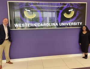 Senior Director of Business and Athletics Steven Jones, left, poses with a representative from Western Carolina University.