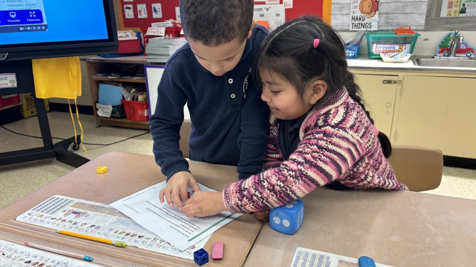 two kids working together in math