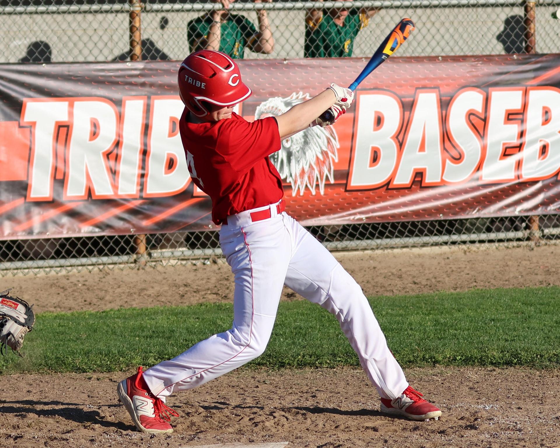 junior varsity baseball players in action
