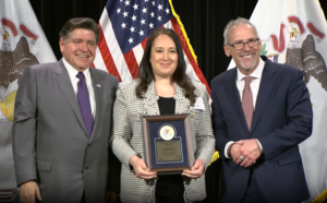Principal Farah Daoud with Governor J.B. Pritzker and Dr. Tony Sanders