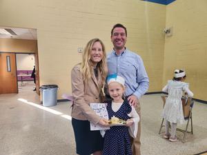 A family poses together after the play.