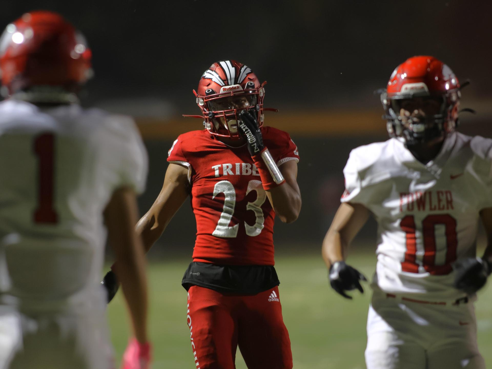 varsity boys playing football against Fowler
