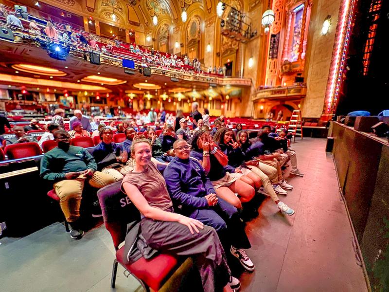 Ms. Strand and her students at Shea's Theater