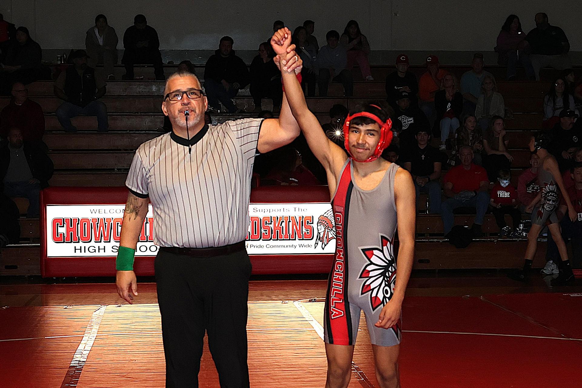 Wrestling winners with hands up 19