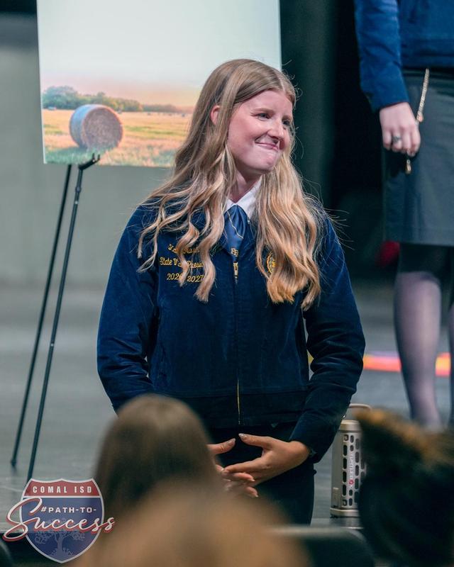 Davenport High School graduate Kate Nash presenting to students on behalf of Future Farmers of America