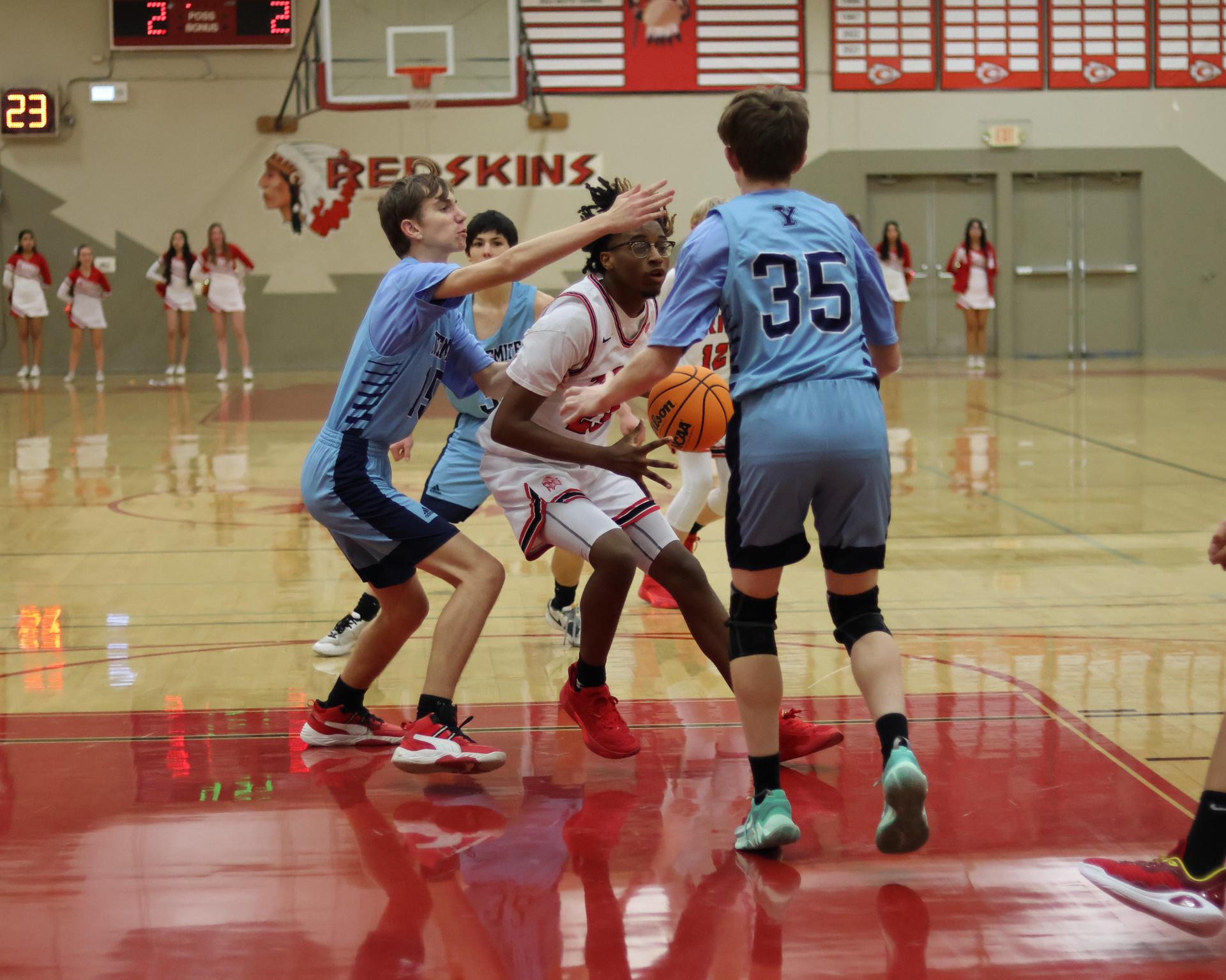 junior varsity boys playing basketball against yosemite
