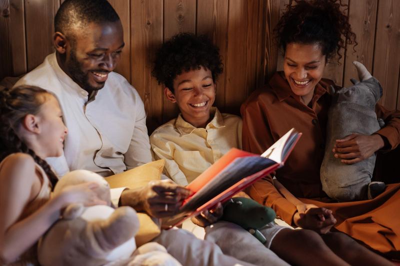 A joyful family reading bedtime stories together