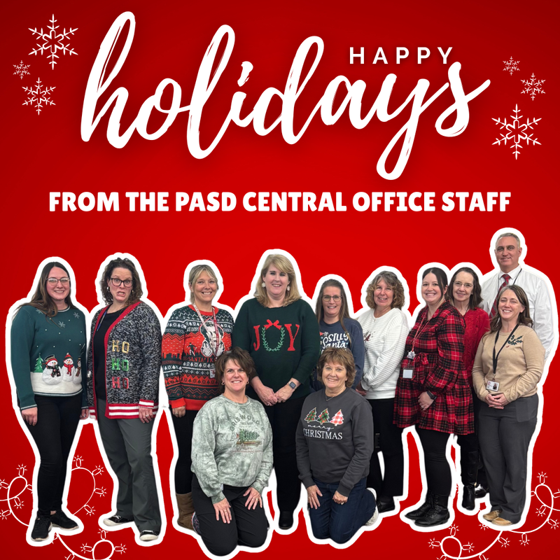 Photo of central office staff members with a red and white snowflake theme