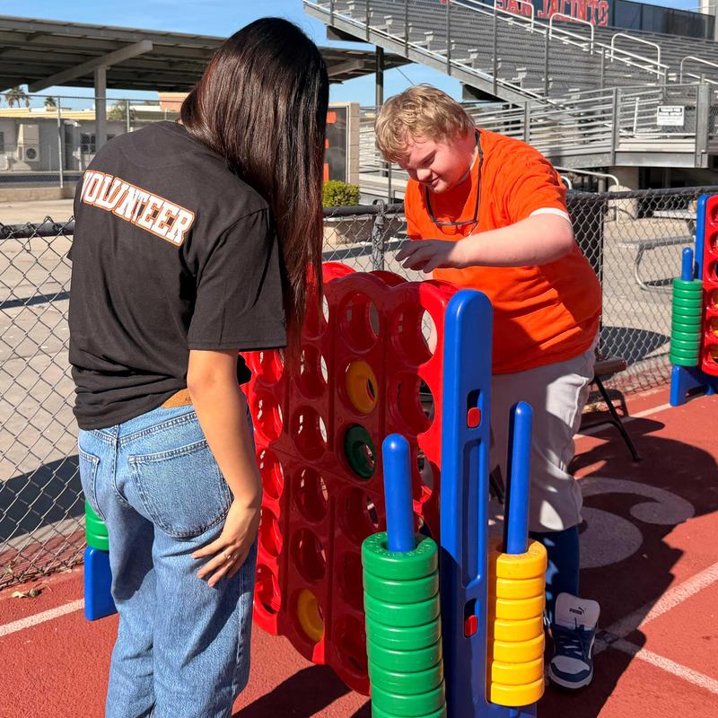 Volunteer and student participant in the Unified Field Day