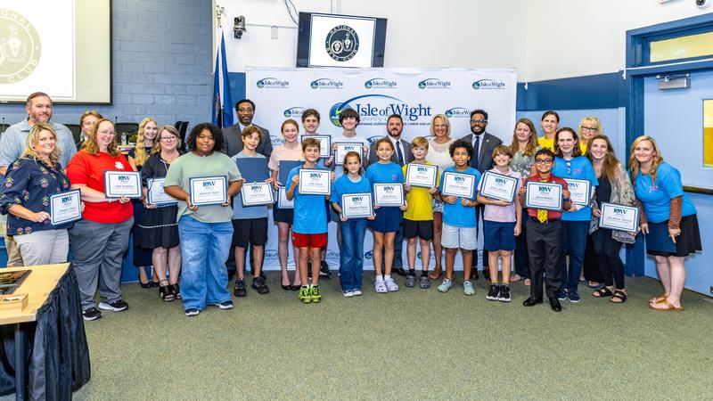 Beta students being recognized for their national accomplishments at September School Board Meeting.