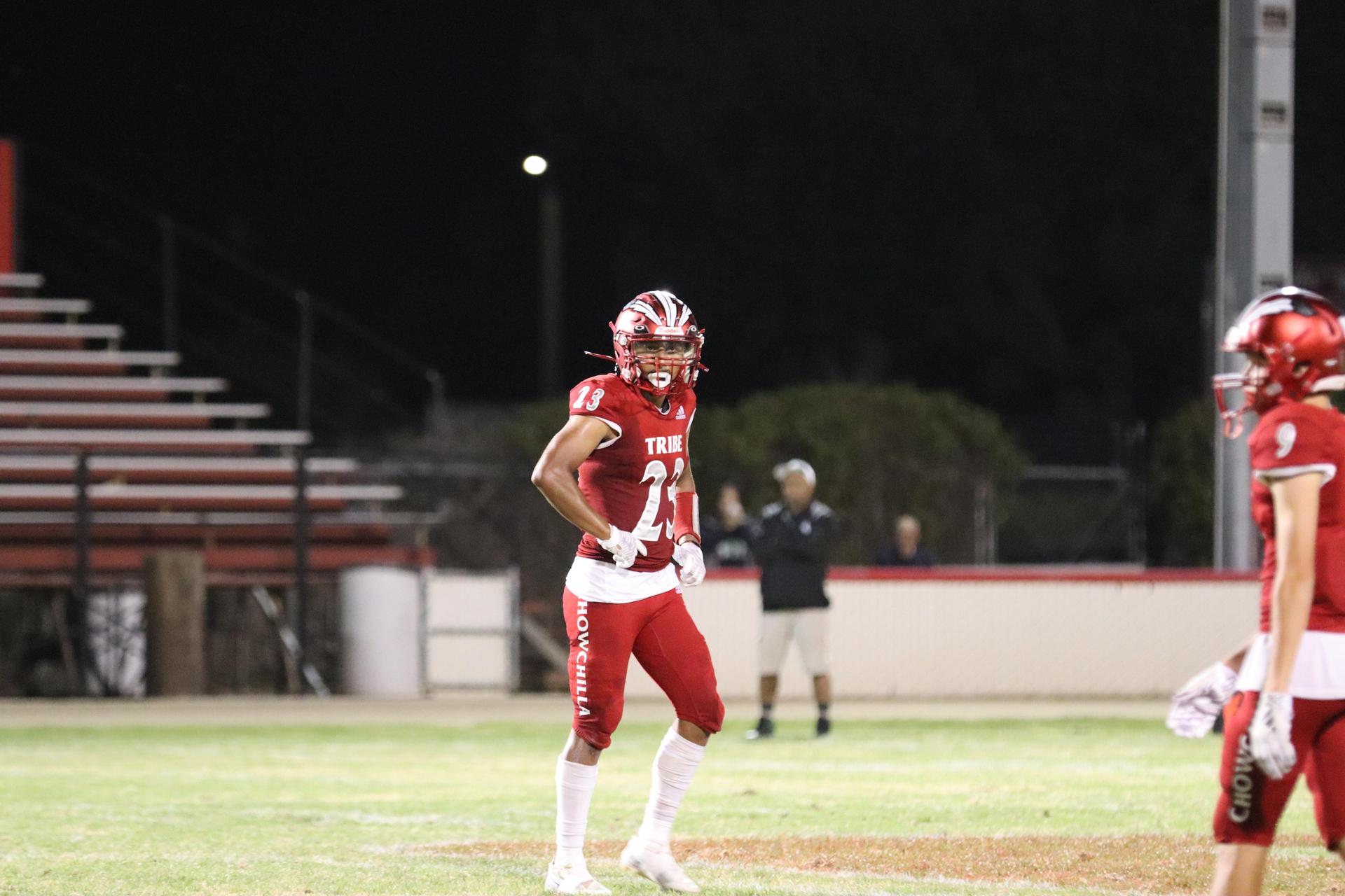 varsity football players in action against Riverdale