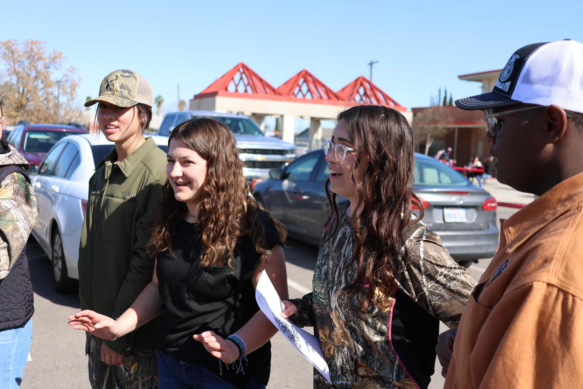 students and staff enjoying the truck pull