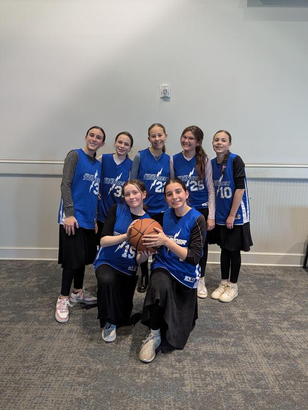 TDSA Thunder girl's team poses before their game at St. Benedicts.