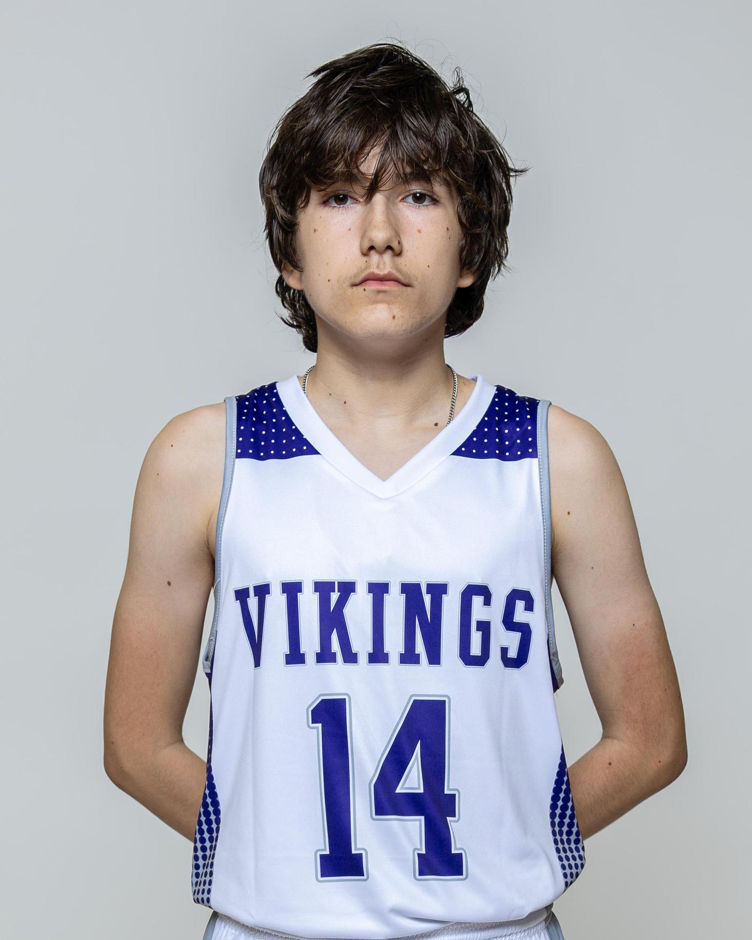 Male player number 14 posing with serious stature for a picture