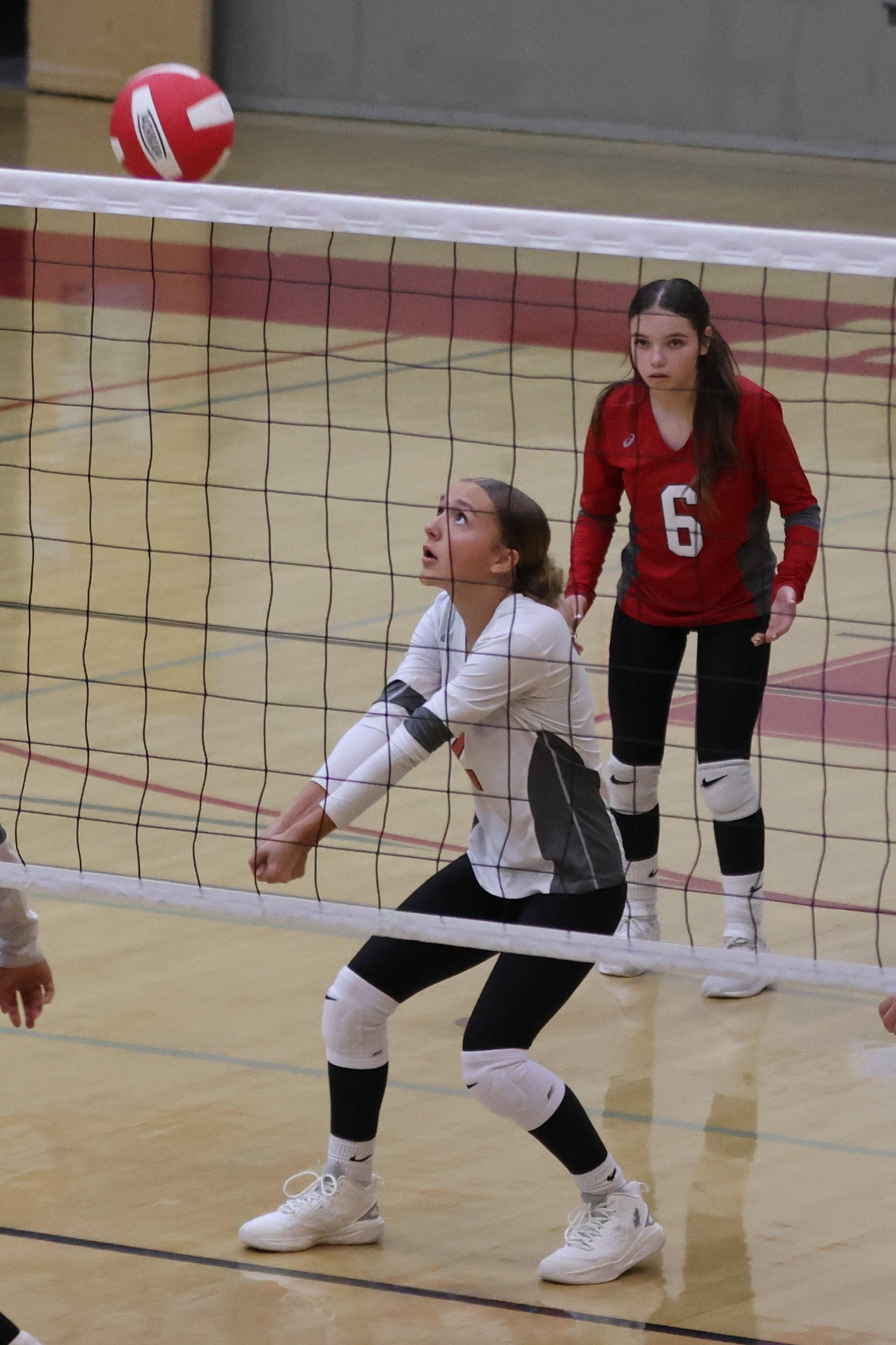 junior varsity girls playing volleyball 68