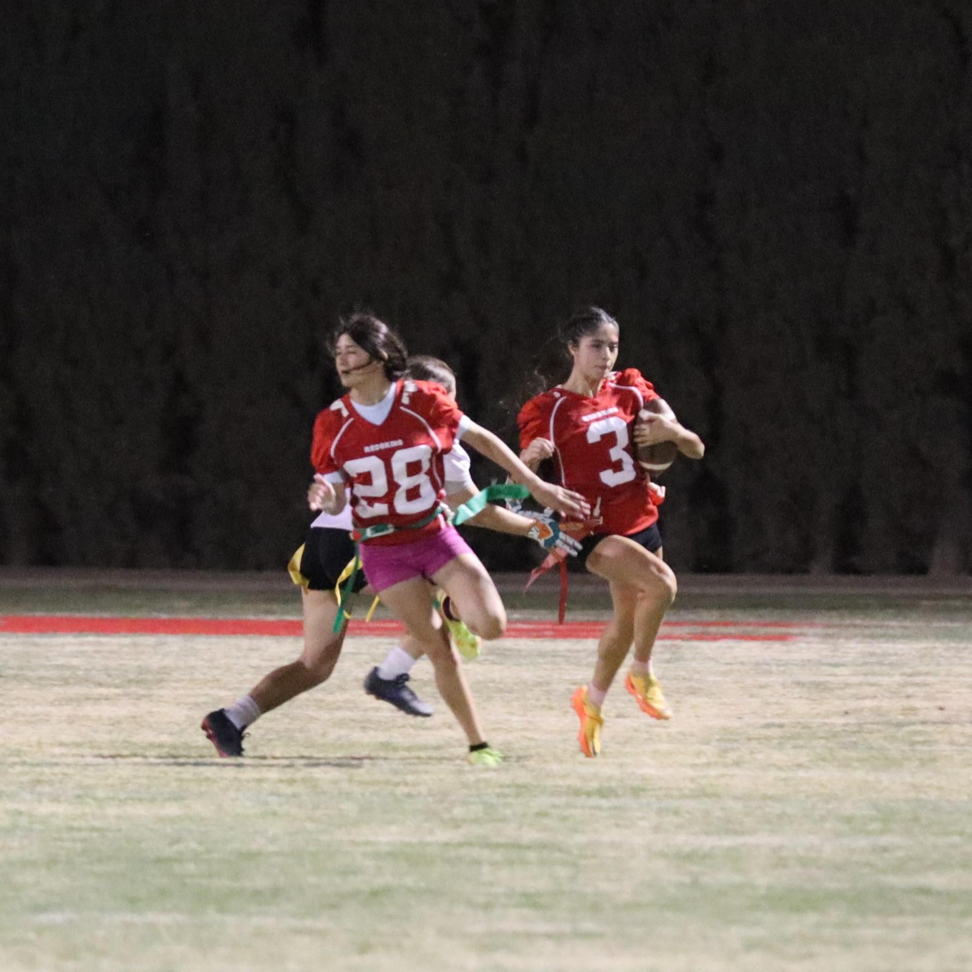 girls playing flag football