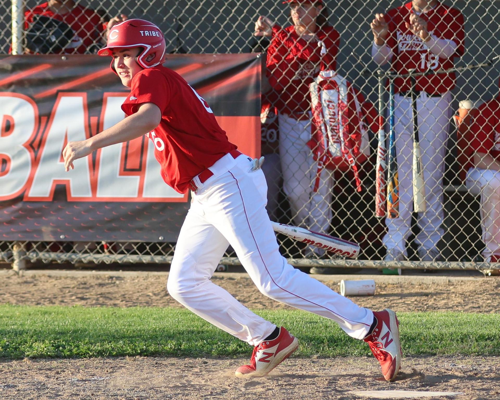 junior varsity baseball players in action