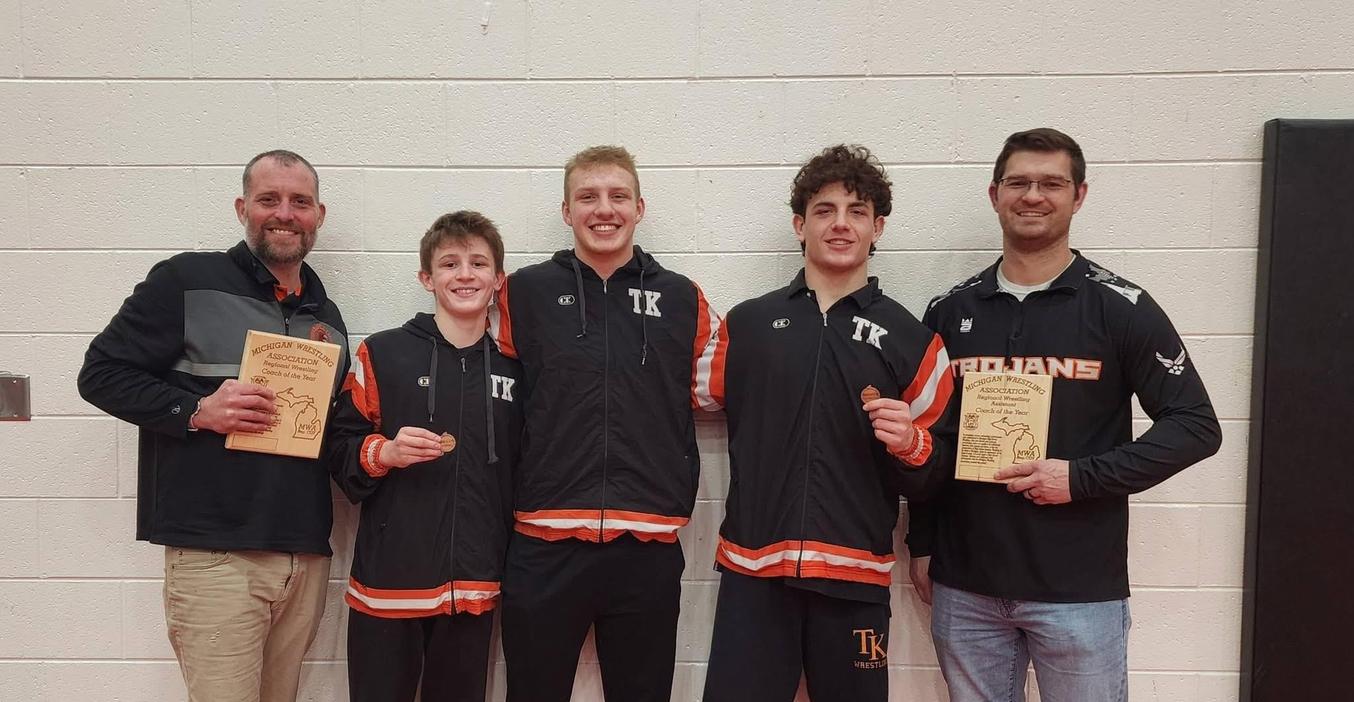 Three wrestlers and two coaches earn state honors.