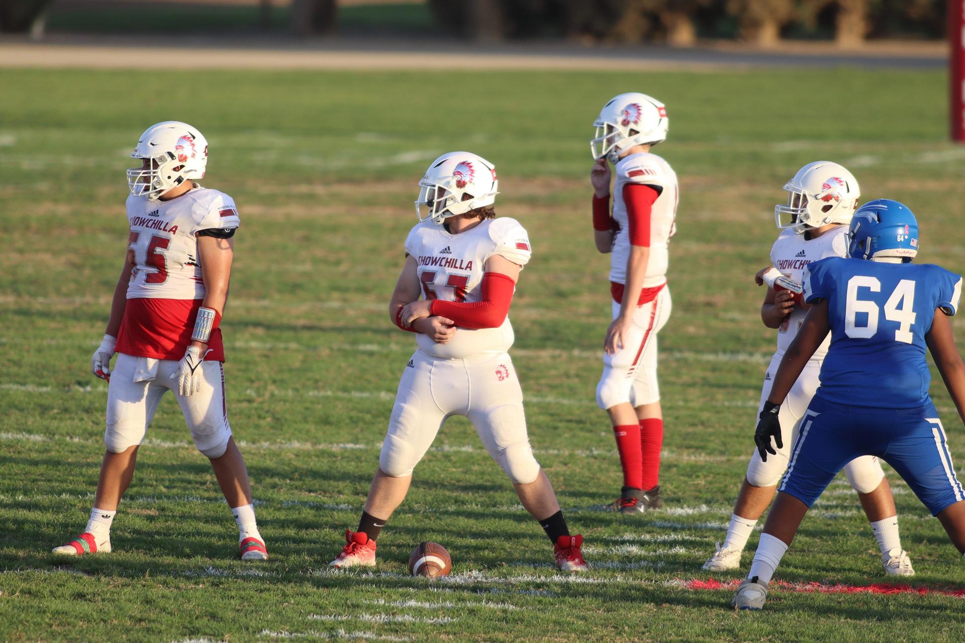 Junior Varsity football players in action against Caruthers