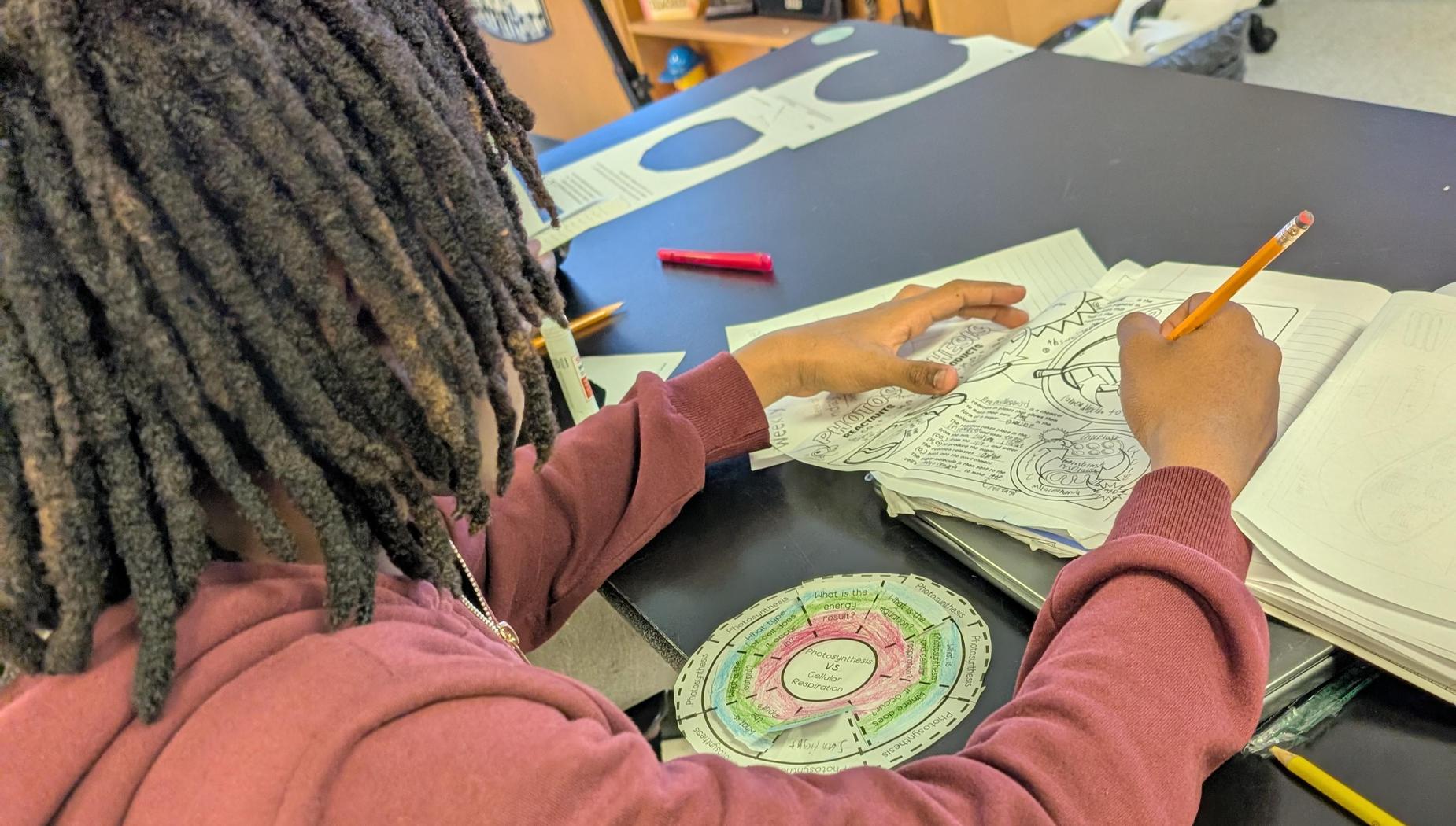 boy taking notes on photosynthesis