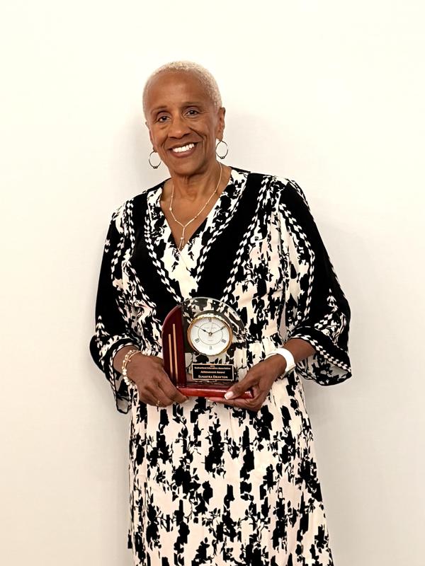 Mrs. Drayton with her REA Award.