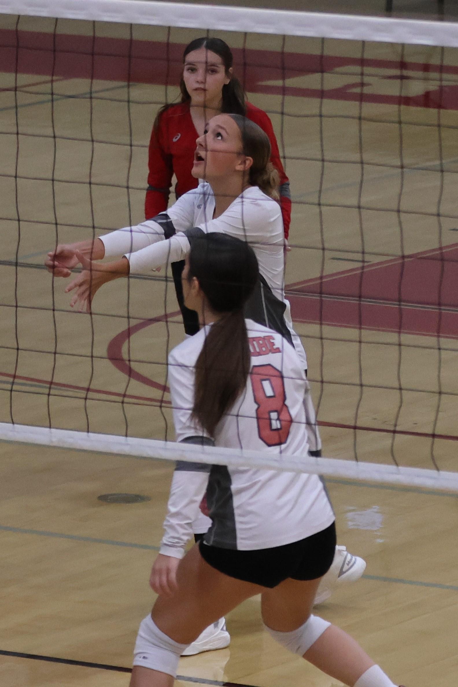 junior varsity girls playing volleyball 66