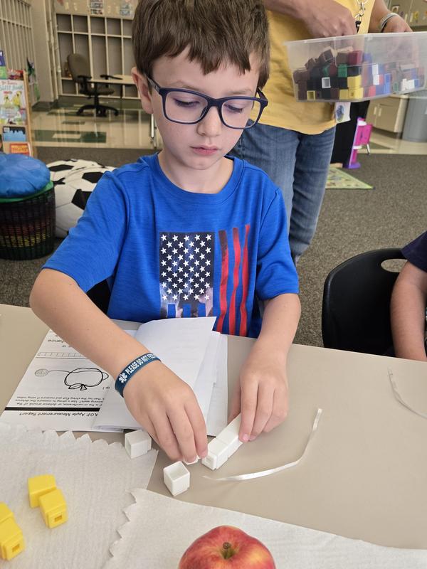 Students help find the prized apple