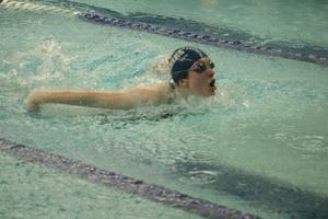 Swimmer does the breaststroke in a competition