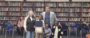 student wrote a book and recognized at a BOE meeting