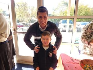 A student poses with his uncle.
