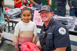 westwind student smiling with lubbock firefighter