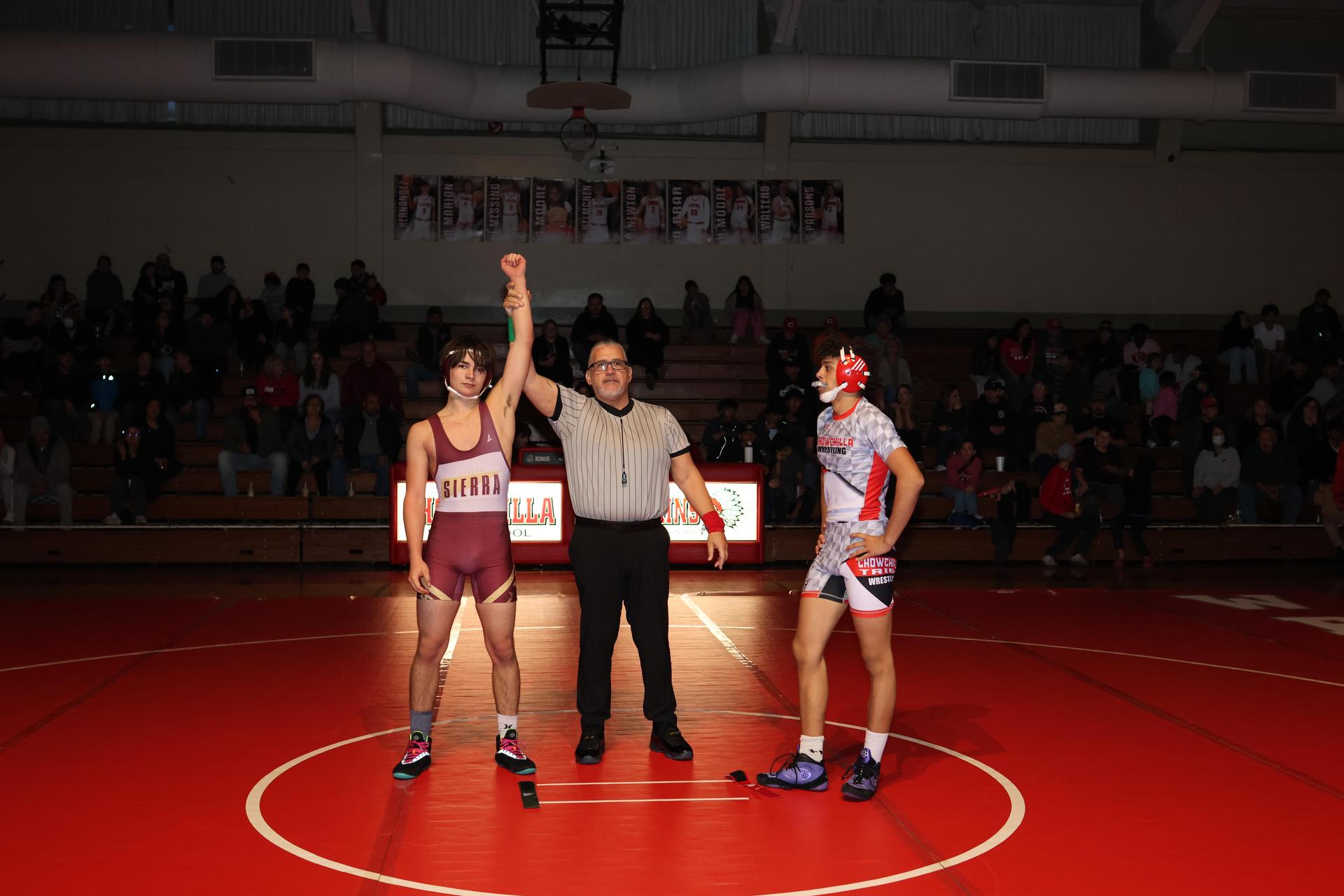 Wrestling winners with hands up 1