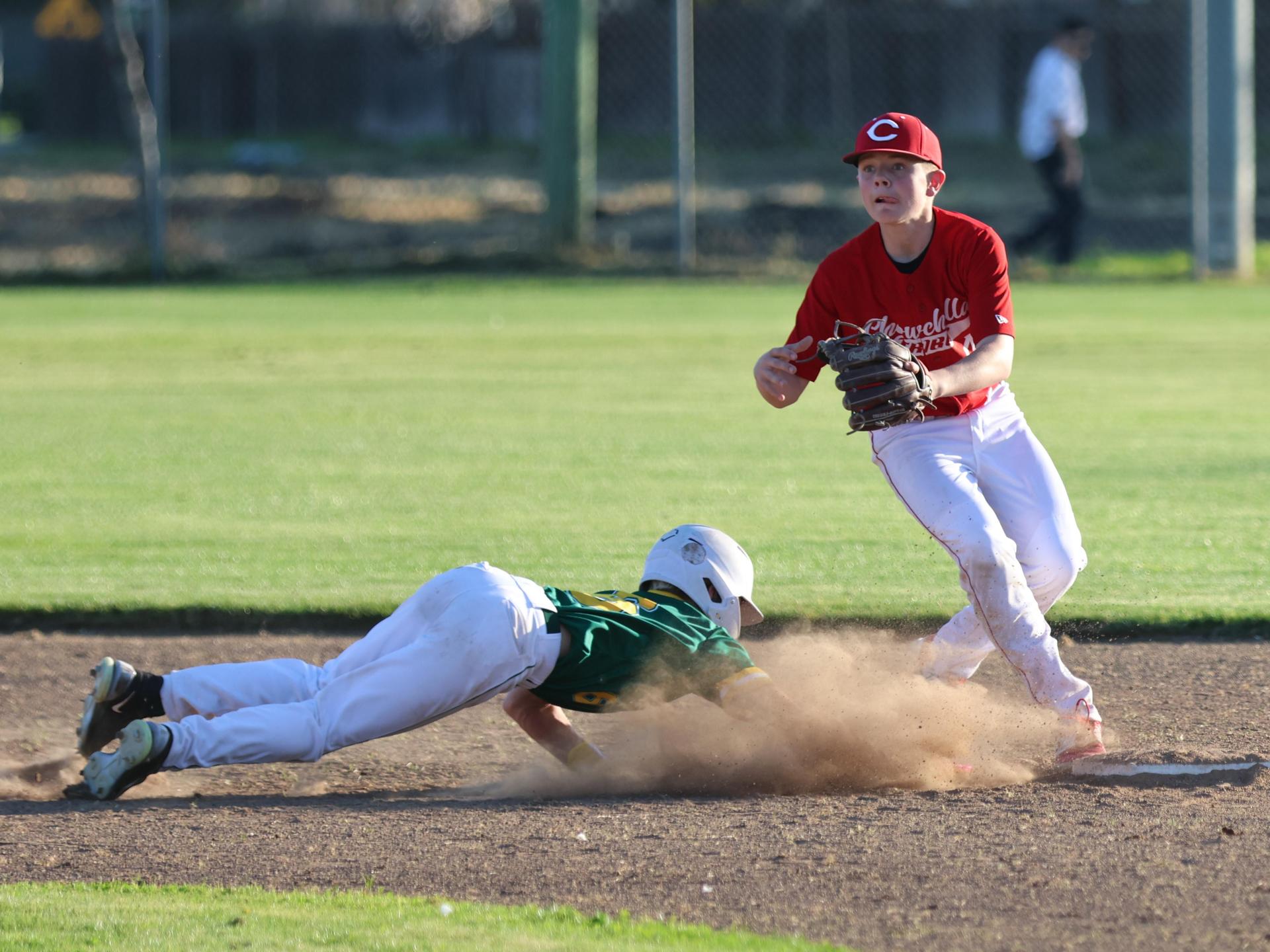 junior varsity baseball players in action
