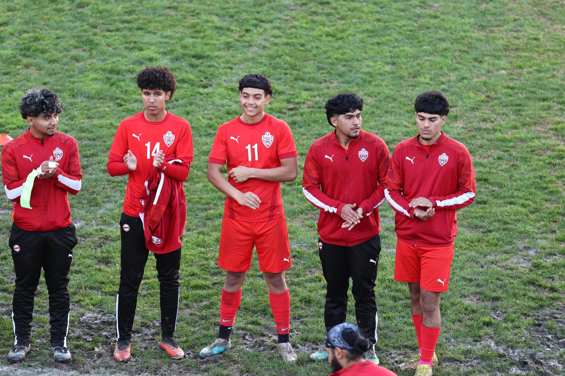 boys varsity soccer team players posing