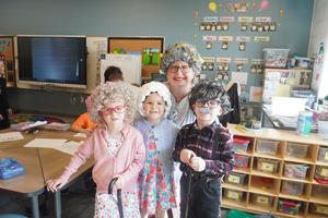 A teacher and several students dress up like old people to celebrate 100th day of school.
