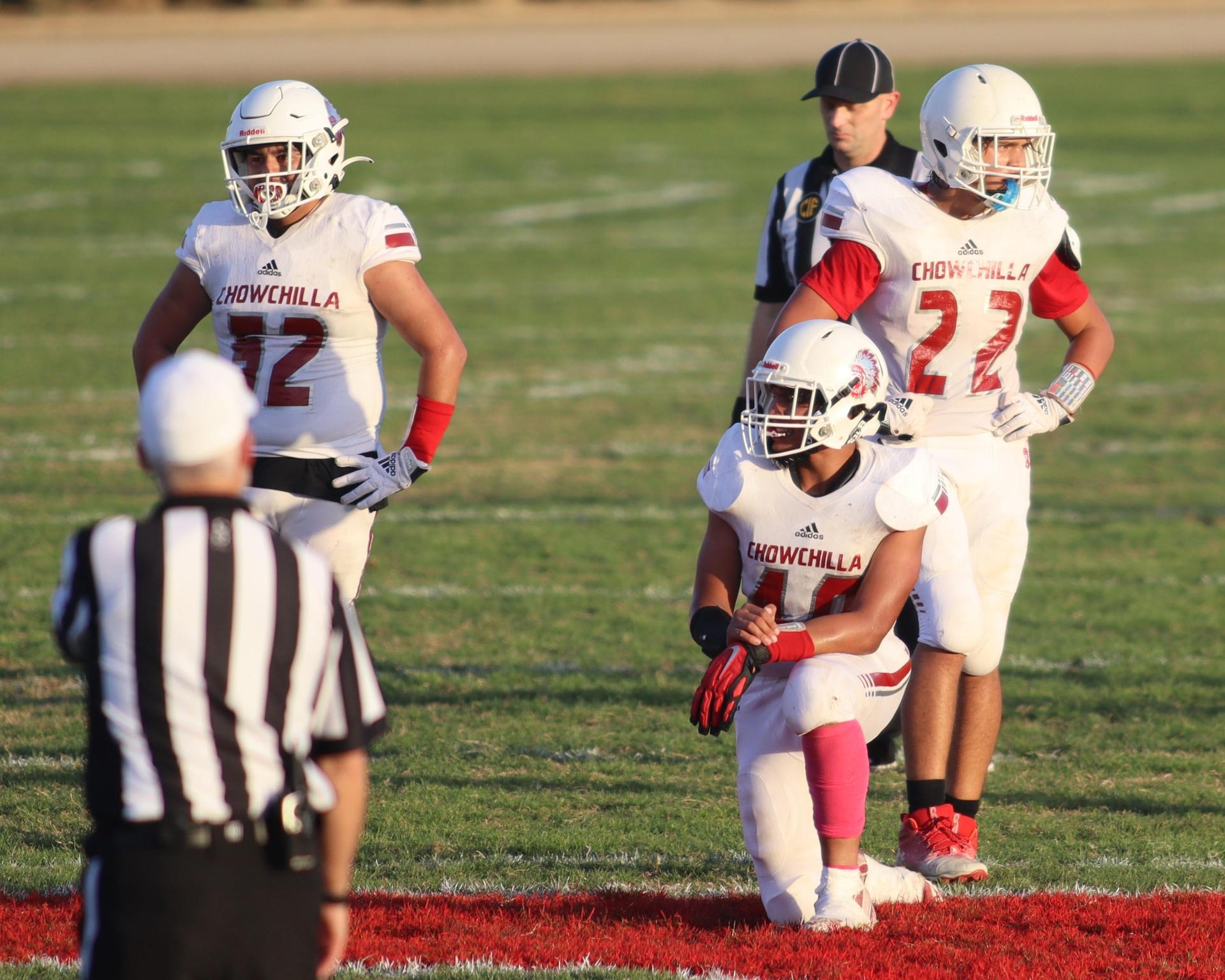 Junior Varsity football players in action against Caruthers